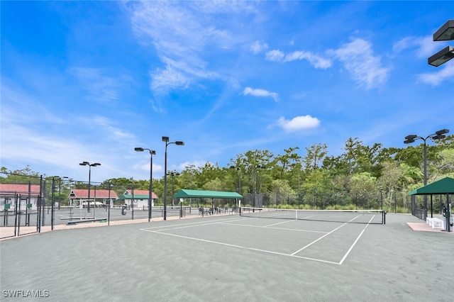 view of sport court with fence