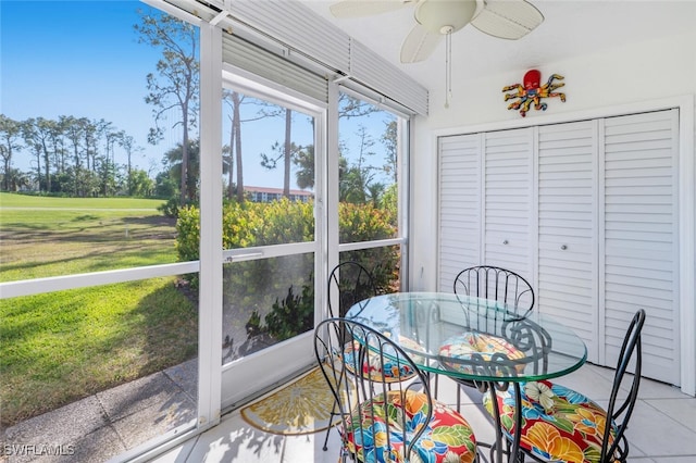 sunroom / solarium with a ceiling fan