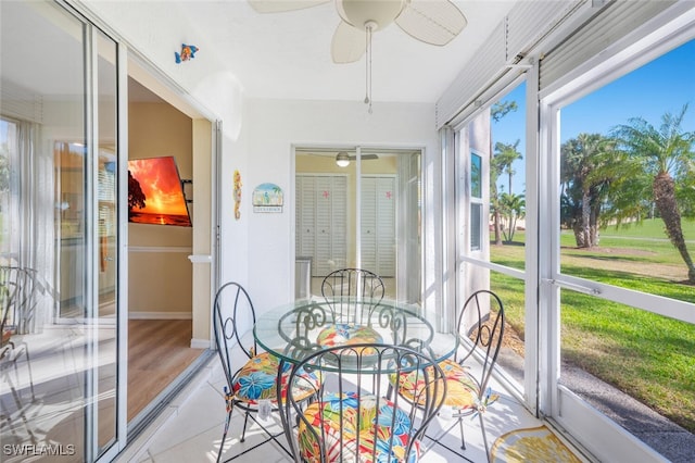 sunroom with a ceiling fan