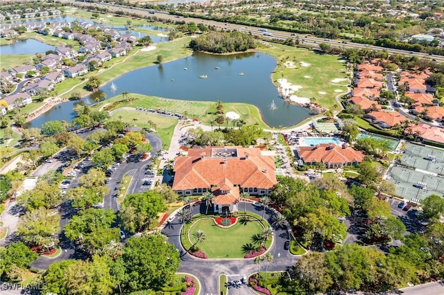 drone / aerial view with a water view and a residential view