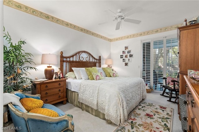 bedroom featuring access to exterior, a ceiling fan, and carpet floors