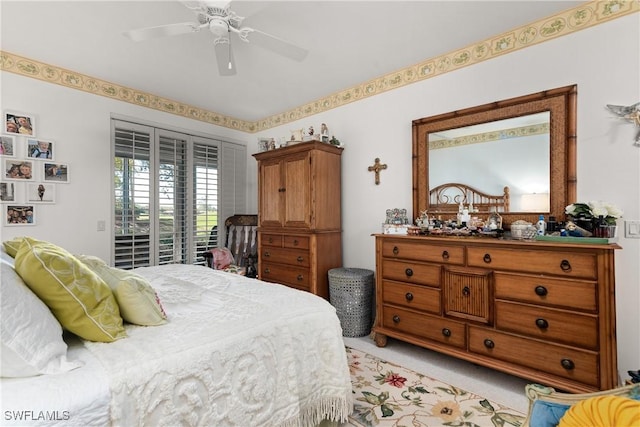 bedroom featuring access to exterior, light colored carpet, and ceiling fan