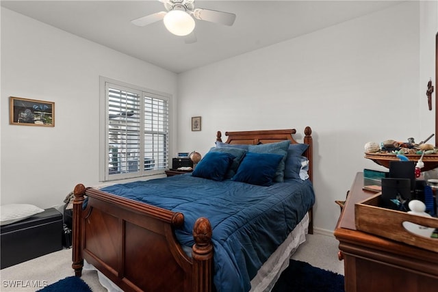 carpeted bedroom with a ceiling fan