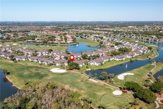 birds eye view of property featuring a residential view, a water view, and view of golf course