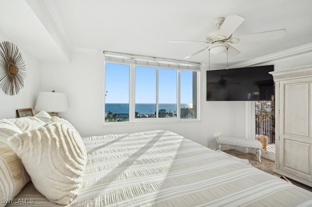 bedroom with ceiling fan and ornamental molding