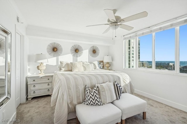 carpeted bedroom featuring ceiling fan and baseboards