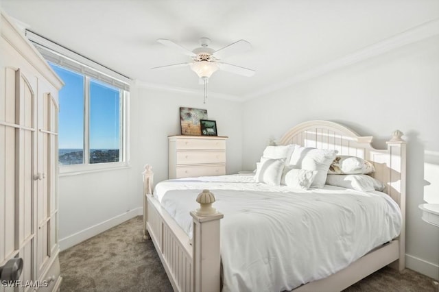 carpeted bedroom with ceiling fan, crown molding, and baseboards