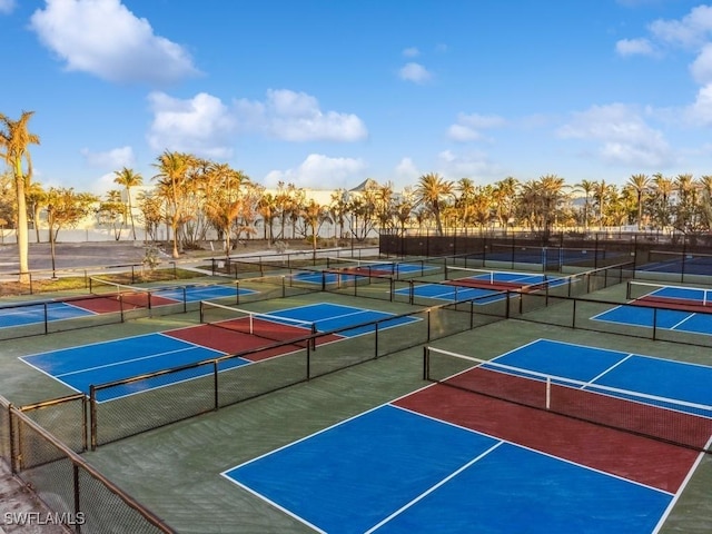 view of tennis court featuring fence