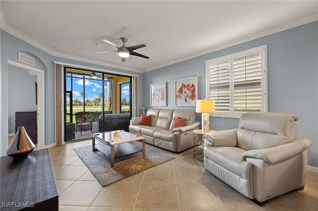 living room with visible vents, tile patterned flooring, a ceiling fan, and crown molding