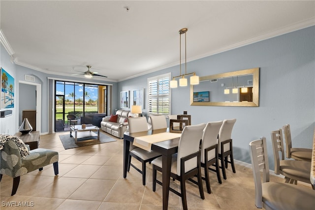 dining space featuring light tile patterned flooring, a healthy amount of sunlight, ornamental molding, and a ceiling fan