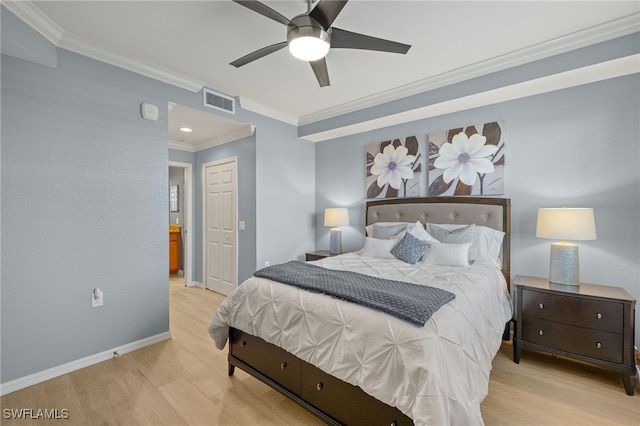 bedroom featuring a closet, ornamental molding, baseboards, and wood finished floors