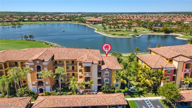 bird's eye view featuring a residential view and a water view