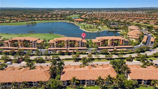 birds eye view of property with a residential view, golf course view, and a water view