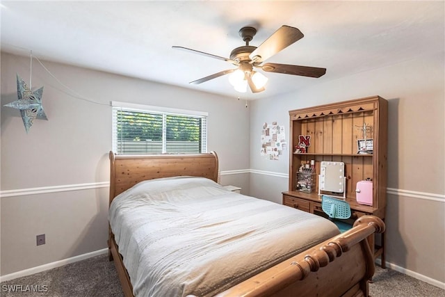 carpeted bedroom with baseboards and ceiling fan