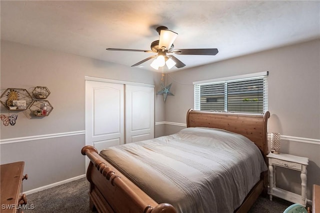 bedroom with a ceiling fan, baseboards, a closet, and dark colored carpet