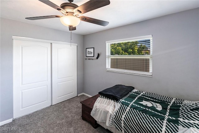 bedroom with a closet, carpet flooring, ceiling fan, and baseboards