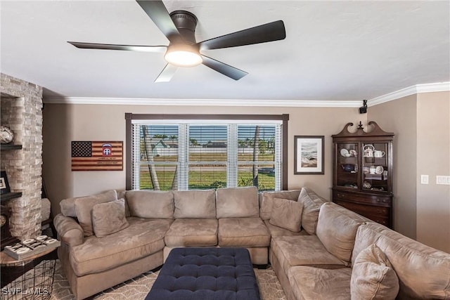 living area featuring ornamental molding, a fireplace, and ceiling fan