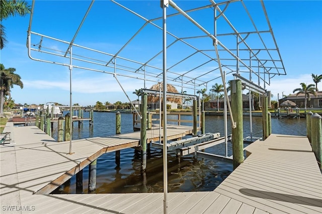 view of dock with a water view and boat lift