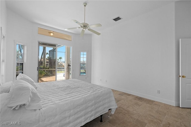 bedroom featuring access to exterior, visible vents, a ceiling fan, and baseboards