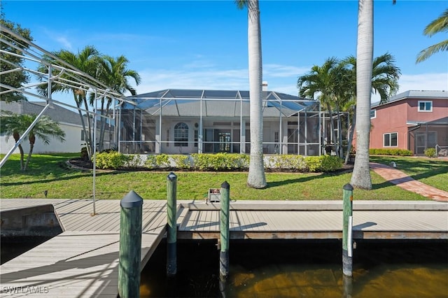 dock area featuring a yard and glass enclosure