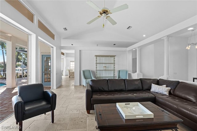 living area featuring visible vents, a ceiling fan, stone tile floors, recessed lighting, and ornate columns