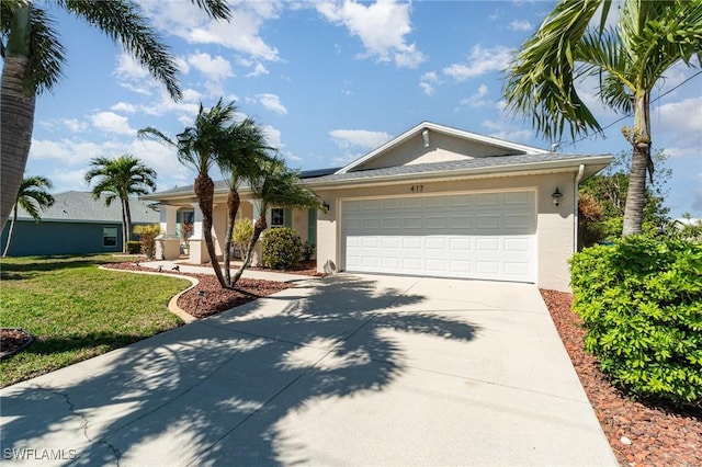417 NW 3rd Ter, Cape Coral, FL 33993 - ranch-style home featuring a front lawn, a garage, driveway, and stucco siding