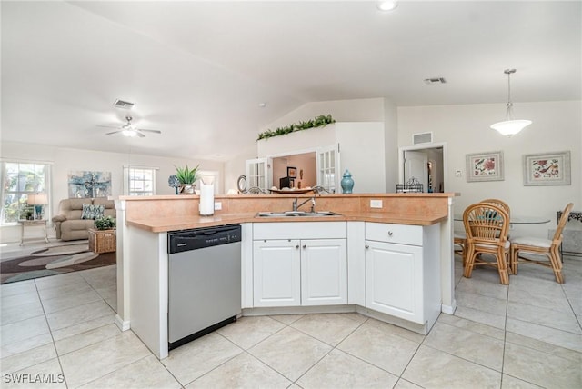 417 NW 3rd Ter, Cape Coral, FL 33993 - kitchen with open floor plan, dishwasher, vaulted ceiling, light tile patterned flooring, and a sink