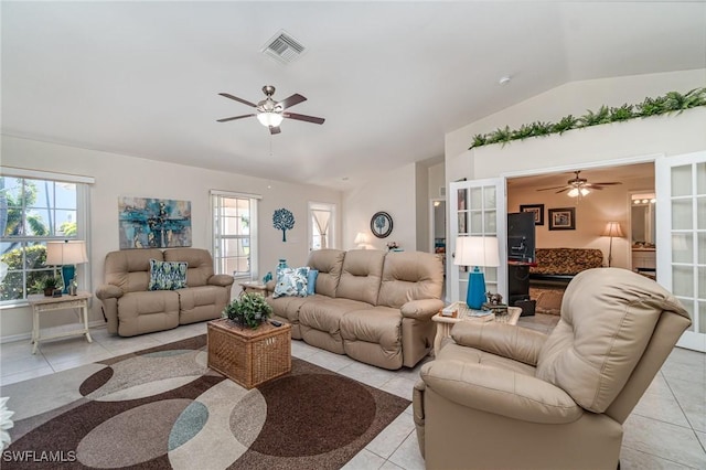 417 NW 3rd Ter, Cape Coral, FL 33993 - living room featuring light tile patterned floors, visible vents, lofted ceiling, and a ceiling fan