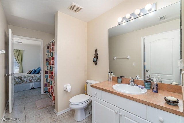 417 NW 3rd Ter, Cape Coral, FL 33993 - bathroom featuring vanity, tile patterned floors, toilet, and visible vents