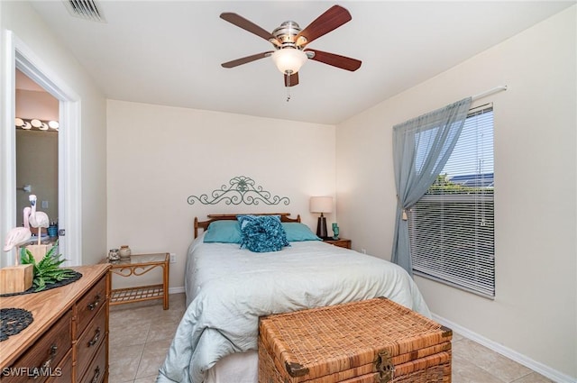 417 NW 3rd Ter, Cape Coral, FL 33993 - bedroom with a ceiling fan, light tile patterned flooring, baseboards, and visible vents
