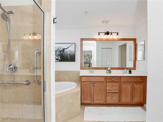 bathroom with a sink, visible vents, a garden tub, and a shower stall