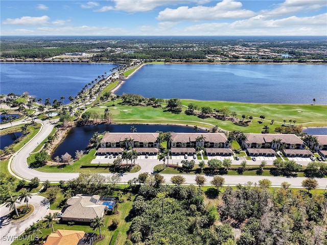 birds eye view of property featuring golf course view, a water view, and a residential view