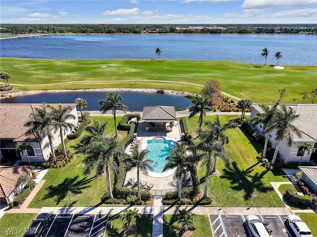 birds eye view of property with a water view and view of golf course