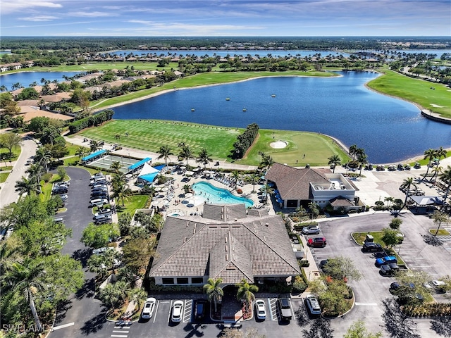 birds eye view of property featuring a water view and golf course view