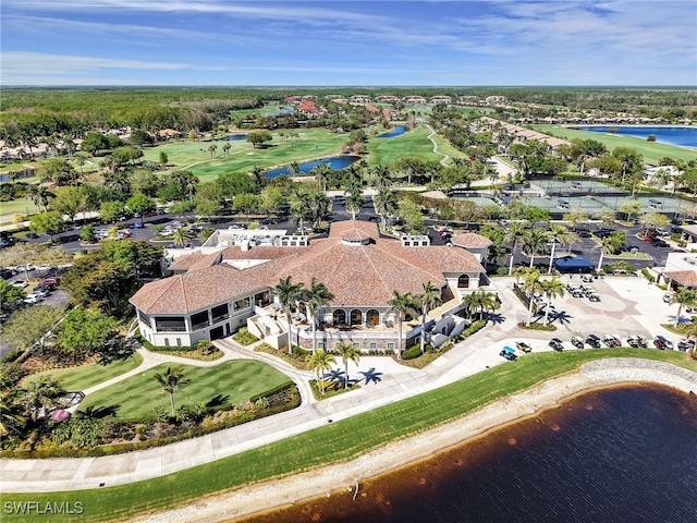 bird's eye view featuring golf course view and a water view