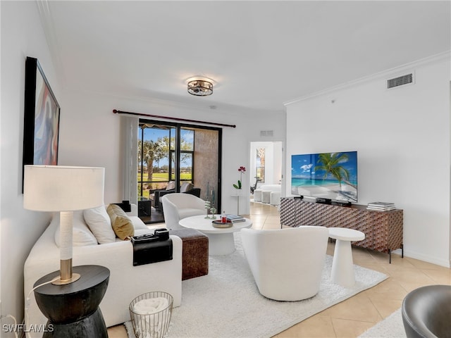 tiled living room featuring baseboards, visible vents, and ornamental molding