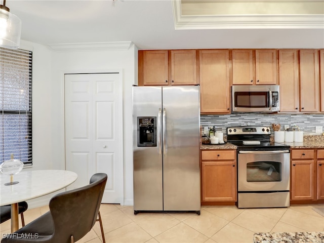 kitchen featuring stone countertops, stainless steel appliances, tasteful backsplash, and ornamental molding