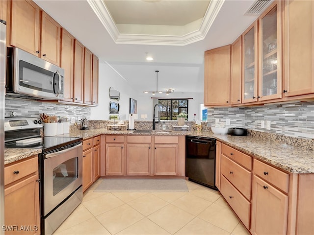 kitchen with light stone countertops, visible vents, a sink, appliances with stainless steel finishes, and a raised ceiling