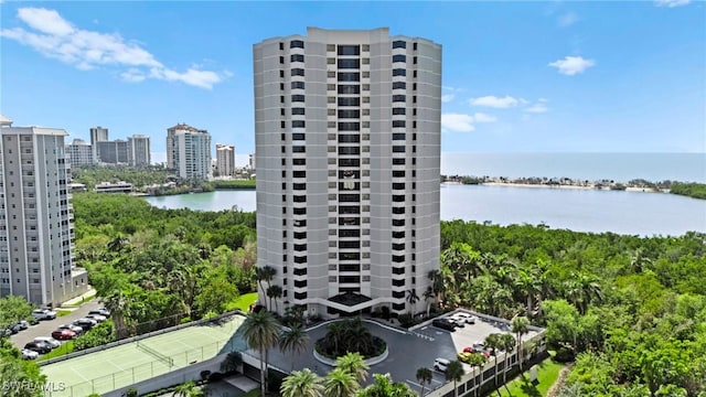 view of property featuring a city view and a water view