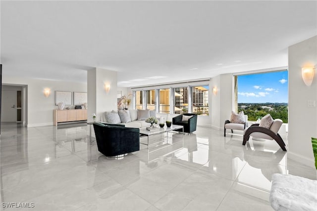 living room with marble finish floor and baseboards