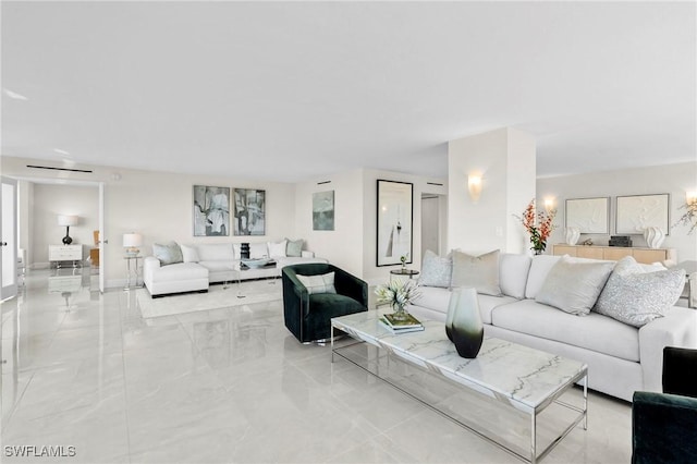 living room featuring marble finish floor