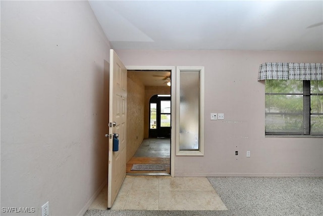 interior space with arched walkways and baseboards