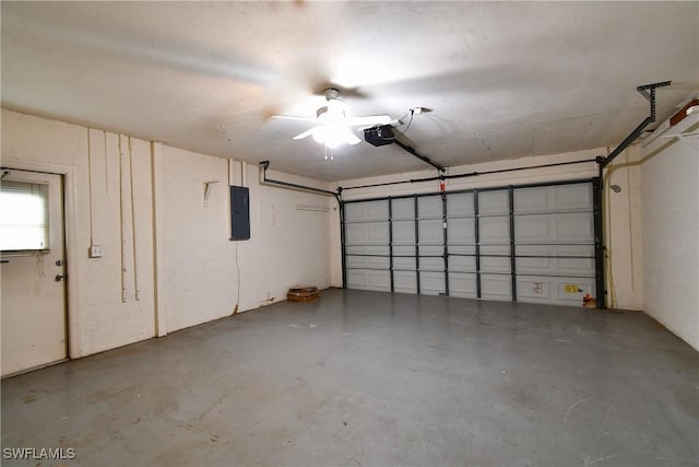 garage with electric panel and a garage door opener