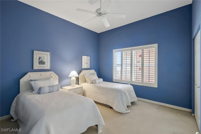 bedroom featuring a ceiling fan, carpet floors, and baseboards