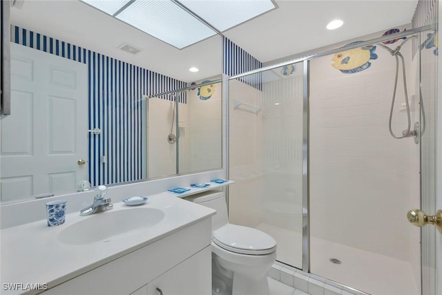 bathroom featuring visible vents, a shower stall, toilet, recessed lighting, and vanity