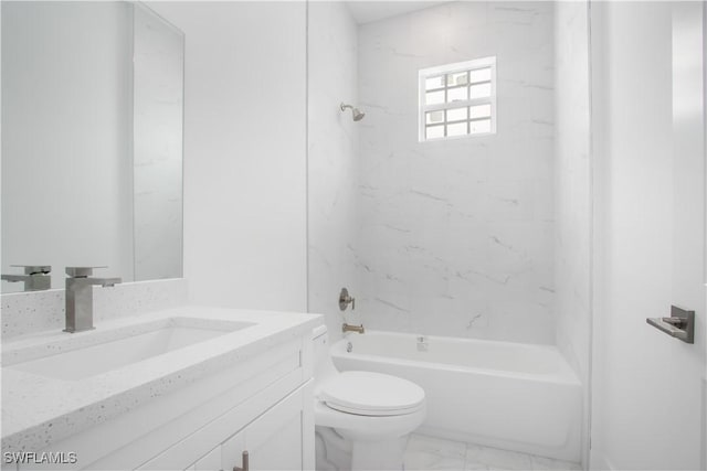 full bath with toilet, marble finish floor, vanity, and washtub / shower combination