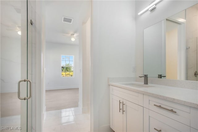 full bathroom with visible vents, ceiling fan, a shower stall, tile patterned floors, and vanity