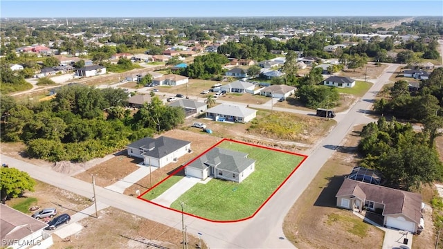 birds eye view of property with a residential view