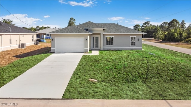 ranch-style house featuring driveway, a garage, stucco siding, a shingled roof, and a front lawn