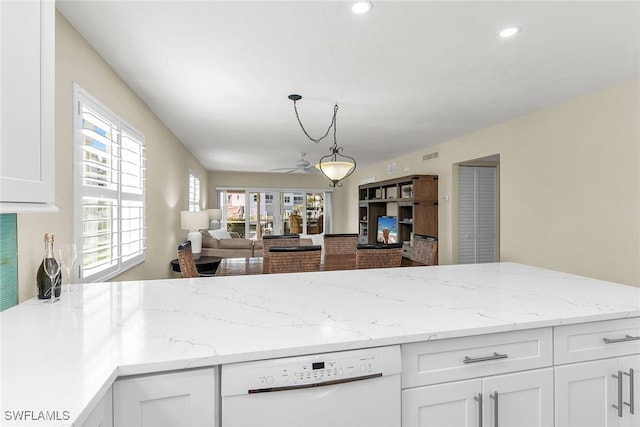 kitchen with light stone counters, recessed lighting, white dishwasher, white cabinetry, and open floor plan